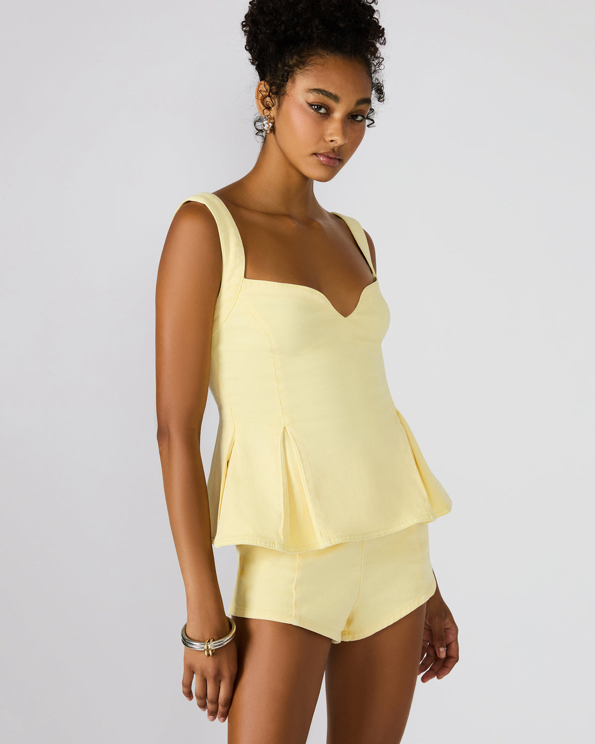 ZENIA Golden Glow Sleeveless Peplum Women's Top